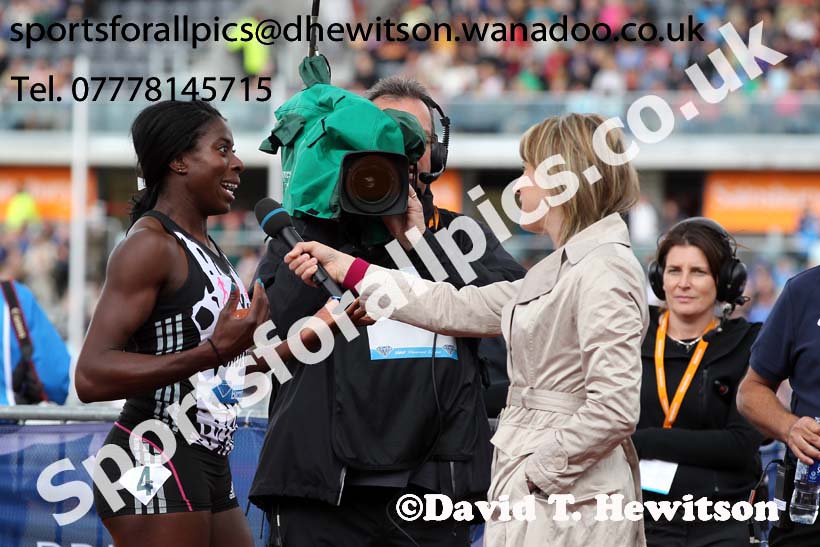 Christine Ohuruogu does an interview for TV after winning the womens 400 metres at the Sainsbury's Birmingham Grand Prix. Photos: David T. Hewitson/Sports for All Pics